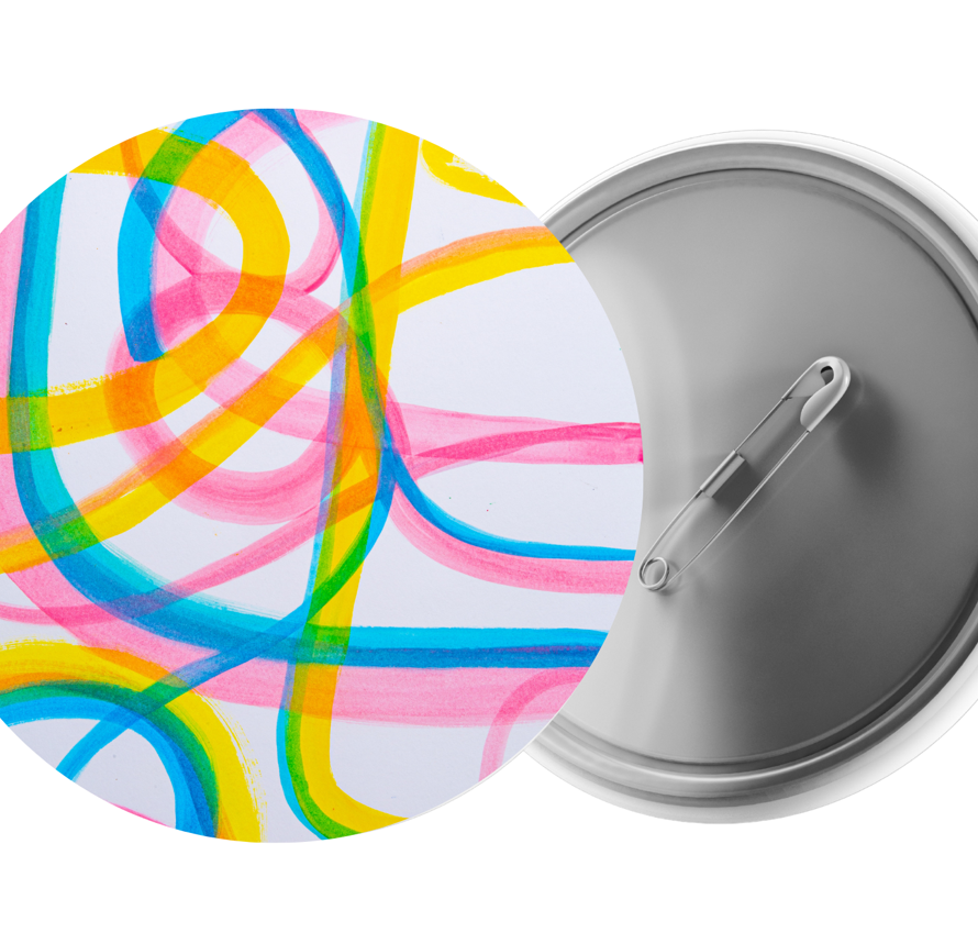 A photo of a badge front and back. The front has a colourful squiggle design on it.