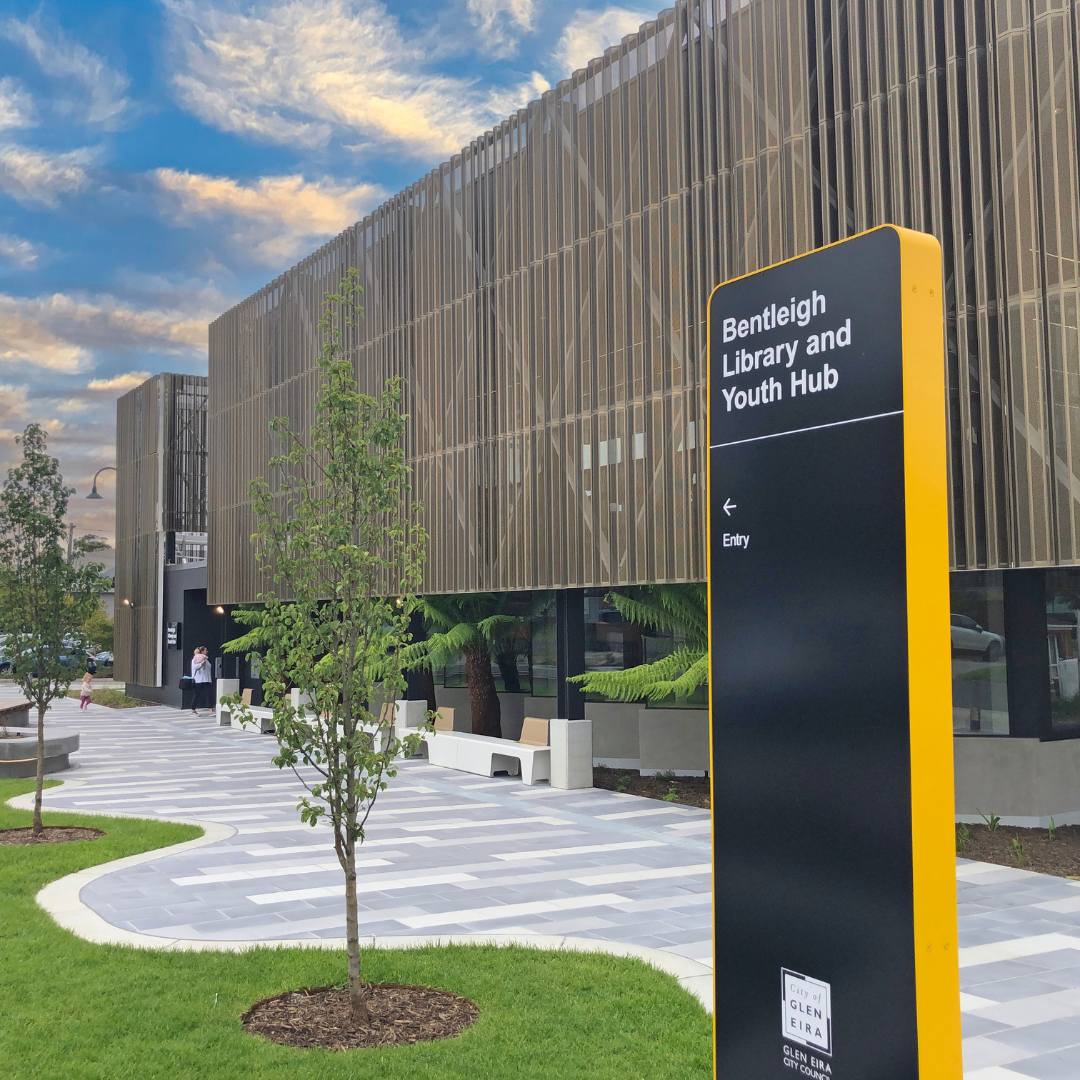 Bentleigh Library and Youth Hub building with entry sign, landscaped path and trees