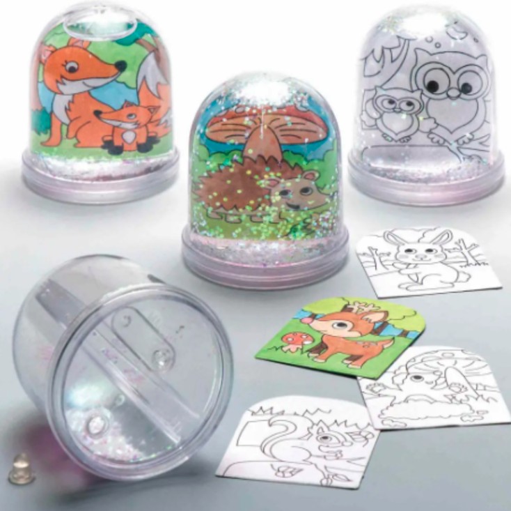 A number of snow globes with animal scenes inside them