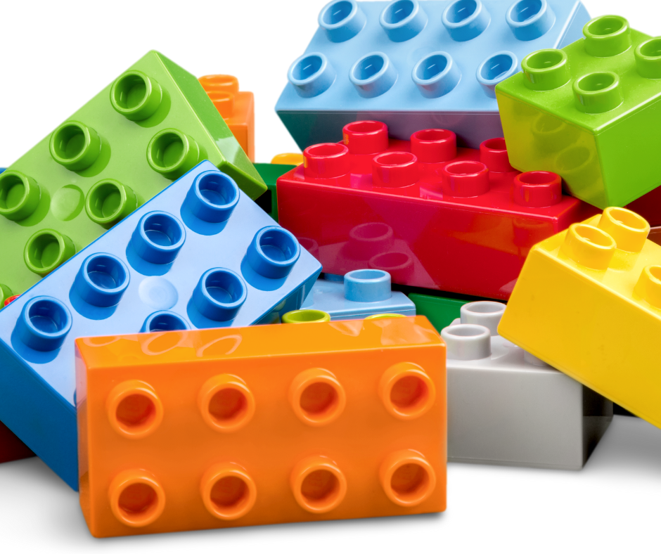 A group of colourful LEGO blocks jumbled together