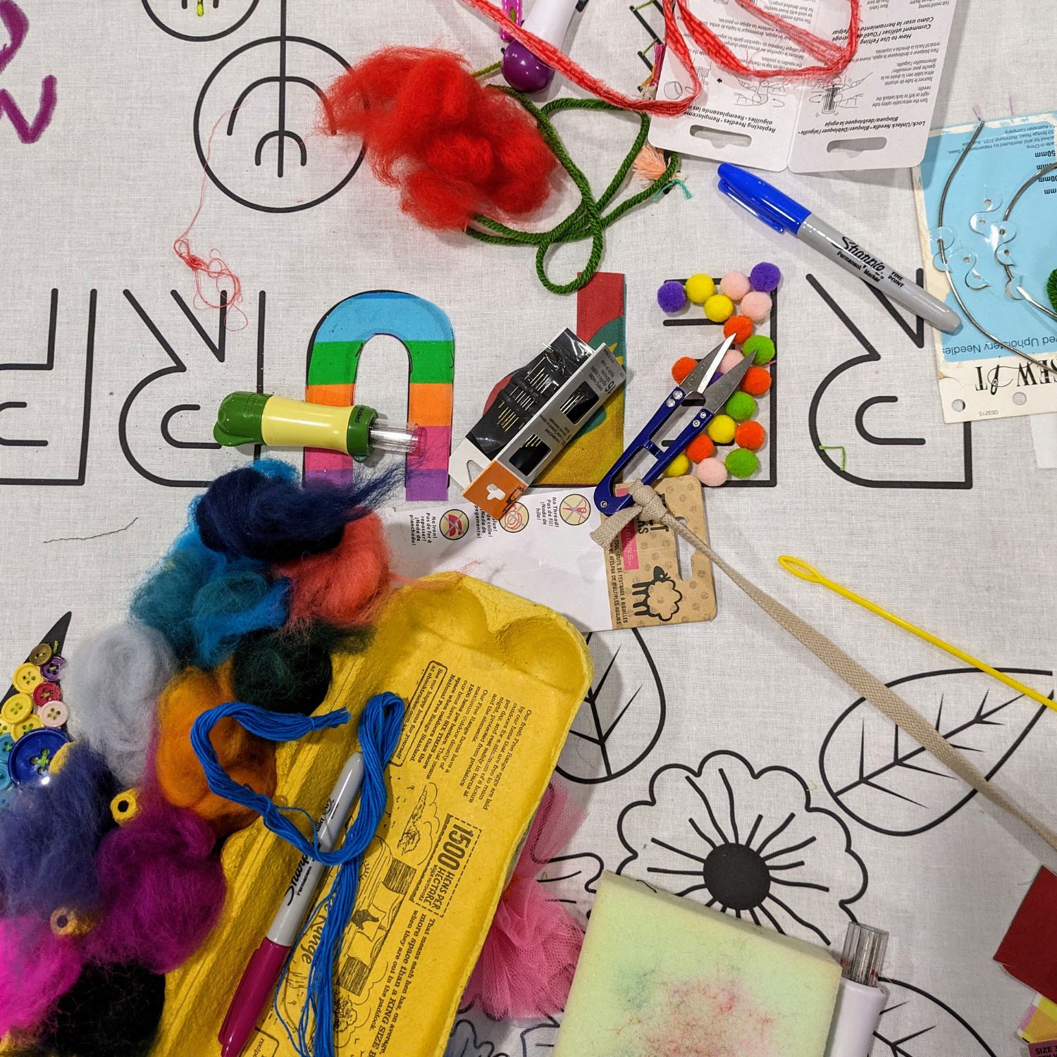 Photo of random craft materials including wool and an egg carton